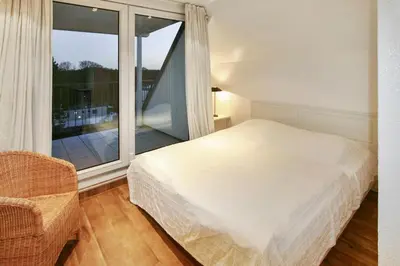 Ein Bett oder Betten in einem Zimmer der Unterkunft Seebrücke Seebrücke Appartement 27