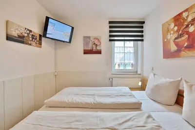 Ein Bett oder Betten in einem Zimmer der Unterkunft Residenz Alte Bergstraße Residenz Alte Bergstrasse Appartement 9