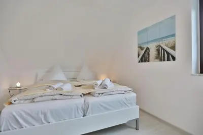 Ein Bett oder Betten in einem Zimmer der Unterkunft Residenz Strandnah Residenz Strandnah Appartement 1