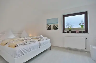 Ein Bett oder Betten in einem Zimmer der Unterkunft Residenz Strandnah Residenz Strandnah Appartement 1