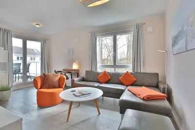 Ein Sitzbereich in der Unterkunft Strandvilla Augustusbad Strandvilla Augustusbad Appartement Riverside