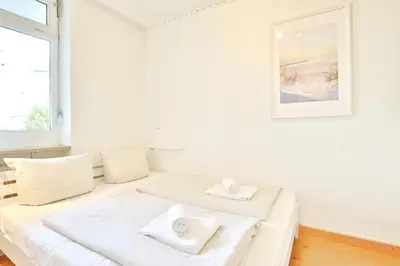 Ein Bett oder Betten in einem Zimmer der Unterkunft Berliner Hof Berliner Hof Appartement 215
