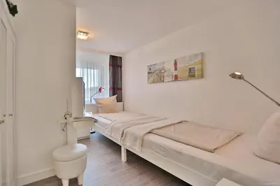 Ein Bett oder Betten in einem Zimmer der Unterkunft Haus Nautica Nautica Appartement 11