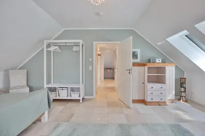 Ein Bett oder Betten in einem Zimmer der Unterkunft Domizil am Eschenweg 5 Domizil am Eschenweg 5 Appartement Ostseerauschen