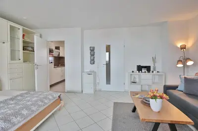 Ein Bett oder Betten in einem Zimmer der Unterkunft Strandburg Strandburg Appartement 1
