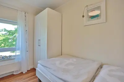 Ein Bett oder Betten in einem Zimmer der Unterkunft Feriendomizil am Konsulweg Feriendomizil am Konsulweg Appartement 6