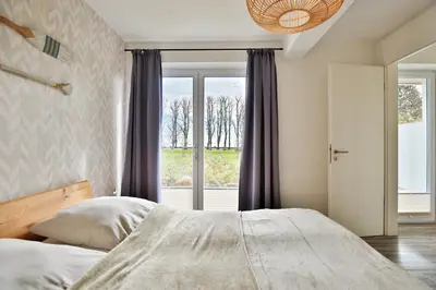 Ein Bett oder Betten in einem Zimmer der Unterkunft Haus Meeresbrise Haus Meeresbrise Appartement 1