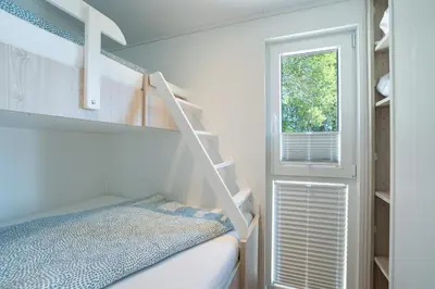 Ein Bett oder Betten in einem Zimmer der Unterkunft Ferienhaus 