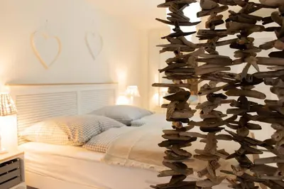 Ein Bett oder Betten in einem Zimmer der Unterkunft Ferienwohnung Sommersitz - Scharbeutz