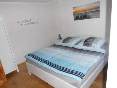 Ein Bett oder Betten in einem Zimmer der Unterkunft Ferienhaus Jantzen