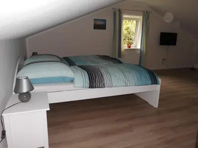 Ein Bett oder Betten in einem Zimmer der Unterkunft Ferienhaus Jantzen