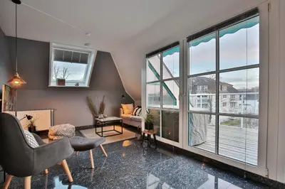 Ein Sitzbereich in der Unterkunft Maison Baltique Niendorf Ferienwohnung 