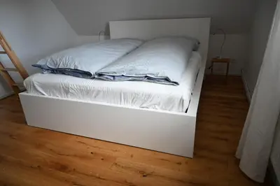 Ein Bett oder Betten in einem Zimmer der Unterkunft Hyggelig in Holstein