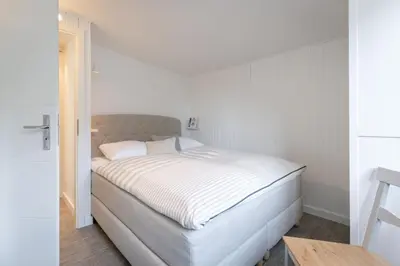 Ein Bett oder Betten in einem Zimmer der Unterkunft Ostseeliebe