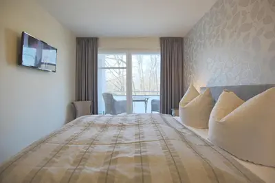 Ein Bett oder Betten in einem Zimmer der Unterkunft Strandglück Haus A Strandglück, App 04a