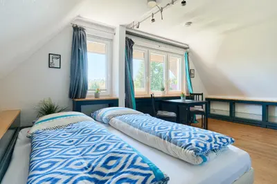 Ein Bett oder Betten in einem Zimmer der Unterkunft Ferienwohnung Ostseeperle Moba-Travel