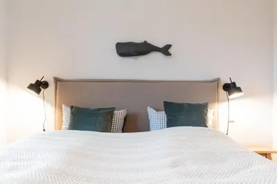 Ein Bett oder Betten in einem Zimmer der Unterkunft Ferienwohnung Ahoi Scharbeutz