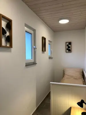Ein Bett oder Betten in einem Zimmer der Unterkunft Erdgeschoss-Appartement mit Seeblick