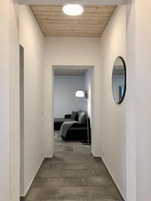 Ein Bett oder Betten in einem Zimmer der Unterkunft Erdgeschoss-Appartement mit Seeblick