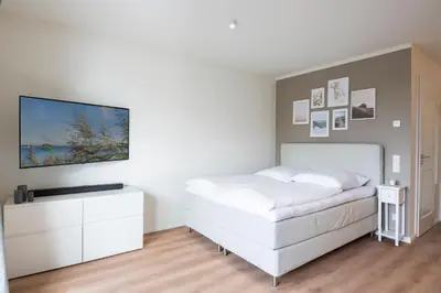 Ein Bett oder Betten in einem Zimmer der Unterkunft Pier 67 Kleine Perle Neustadt