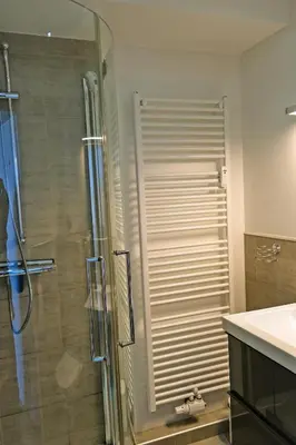 Ein Badezimmer in der Unterkunft Oase mit Meerblick, Schwimmbad & nahe Hansapark, kostenlos Parken