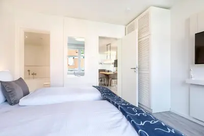 Ein Bett oder Betten in einem Zimmer der Unterkunft Godewindpark Travemünde Godewindpark Travemünde 1-01