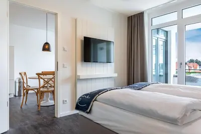 Ein Bett oder Betten in einem Zimmer der Unterkunft Godewindpark Travemünde Godewindpark Travemünde 3-13