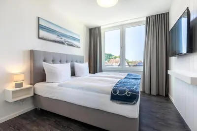 Ein Bett oder Betten in einem Zimmer der Unterkunft Godewindpark Travemünde Godewindpark Travemünde 3-17