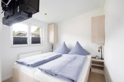 Ein Bett oder Betten in einem Zimmer der Unterkunft Ostseecamp Lübecker Bucht Ferienhaus 