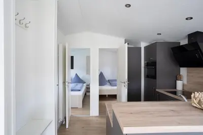 Ein Bett oder Betten in einem Zimmer der Unterkunft Ostseecamp Lübecker Bucht Ferienhaus 