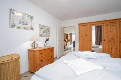 Ein Bett oder Betten in einem Zimmer der Unterkunft OST29b Ferienwohnung Muschelbank