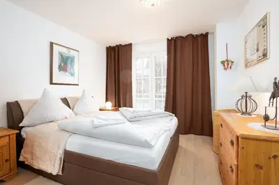 Ein Bett oder Betten in einem Zimmer der Unterkunft OST29b Ferienwohnung Muschelbank