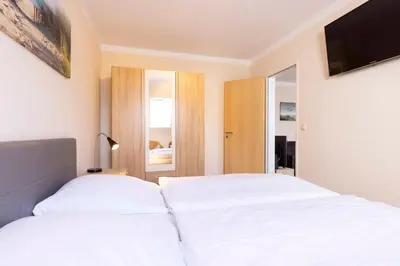 Ein Bett oder Betten in einem Zimmer der Unterkunft MEI27a Ferienwohnung Ostseetraum