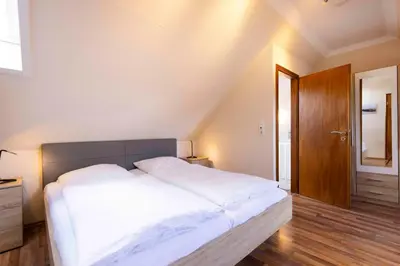 Ein Bett oder Betten in einem Zimmer der Unterkunft MEI27a Ferienwohnung Ostseetraum