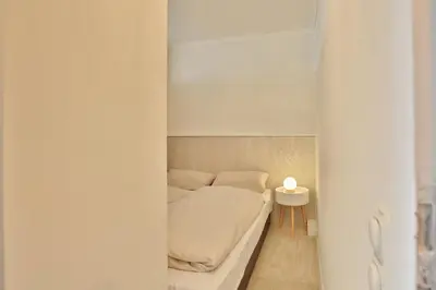 Ein Bett oder Betten in einem Zimmer der Unterkunft Seetempel Seetempel Appartement 38