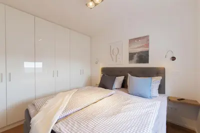 Ein Bett oder Betten in einem Zimmer der Unterkunft Ferienwohung BeachSide No 20
