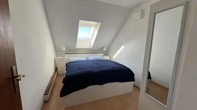 Ein Bett oder Betten in einem Zimmer der Unterkunft Travemünde Leuchtfeuer
