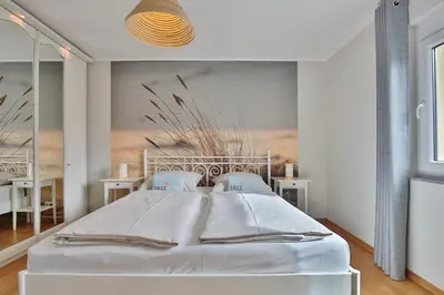 Ein Bett oder Betten in einem Zimmer der Unterkunft Haus Sommerwind Sommerwind, Appartement 4