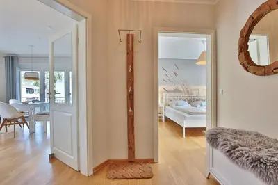 Ein Bett oder Betten in einem Zimmer der Unterkunft Haus Sommerwind Sommerwind, Appartement 4