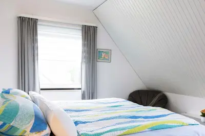 Ein Bett oder Betten in einem Zimmer der Unterkunft STOE3 Ferienwohnung Waack