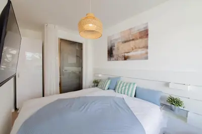 Ein Bett oder Betten in einem Zimmer der Unterkunft Ferienwohnung Ocean Lodge Travemünde