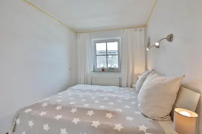 Ein Bett oder Betten in einem Zimmer der Unterkunft Residenz Alte Bergstraße Res Alte Bergstr , App 14