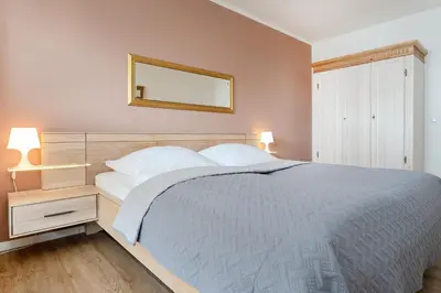 Ein Bett oder Betten in einem Zimmer der Unterkunft Haus Meeresstrand Wohnung 106