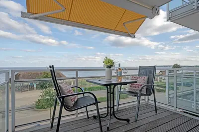 Ein Balkon oder eine Terrasse in der Unterkunft Strand Domizil Wohnung 12