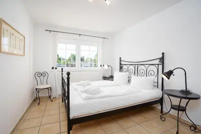 Ein Bett oder Betten in einem Zimmer der Unterkunft Strand Domizil MeerZeit