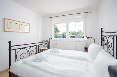 Ein Bett oder Betten in einem Zimmer der Unterkunft Strand Domizil MeerZeit