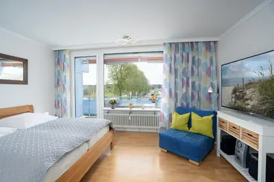 Ein Bett oder Betten in einem Zimmer der Unterkunft Seetempel Wohnung 23
