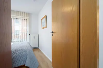 Ein Bett oder Betten in einem Zimmer der Unterkunft Strandresidenz Wohnung 1