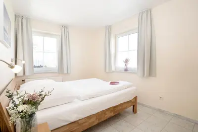 Ein Bett oder Betten in einem Zimmer der Unterkunft Strandallee 92b- Wohnung 18