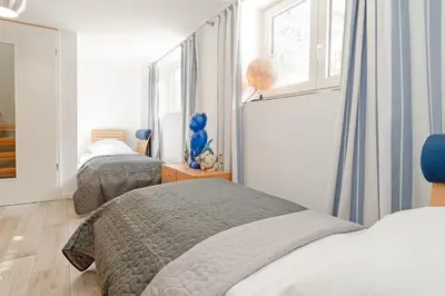 Ein Bett oder Betten in einem Zimmer der Unterkunft Strandallee 100 Küstenliebe
